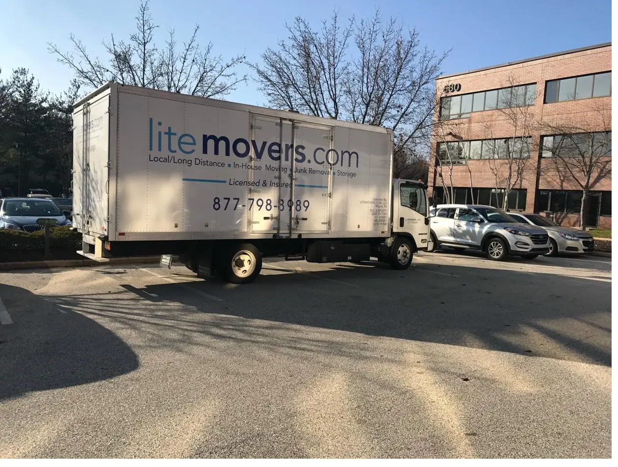 LiteMovers box truck parked at an office building on a moving job