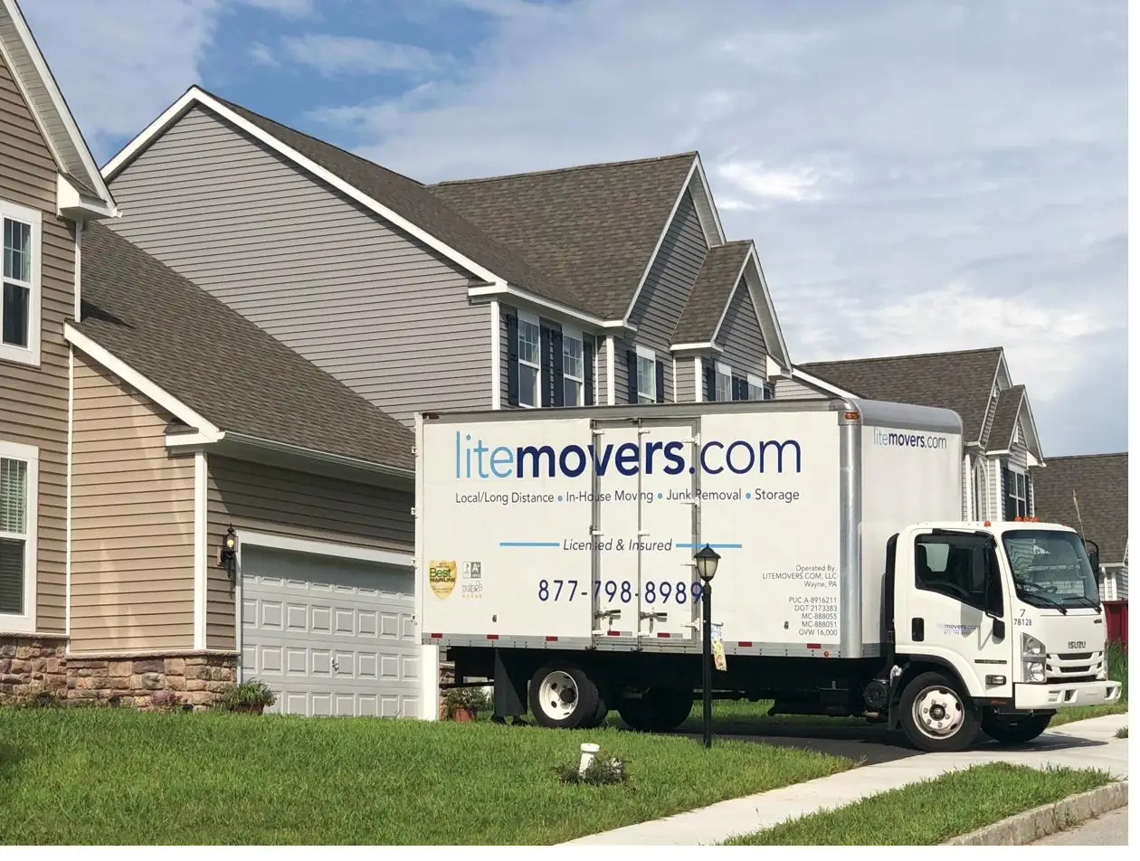 LiteMovers box truck delivering to a new two-story home