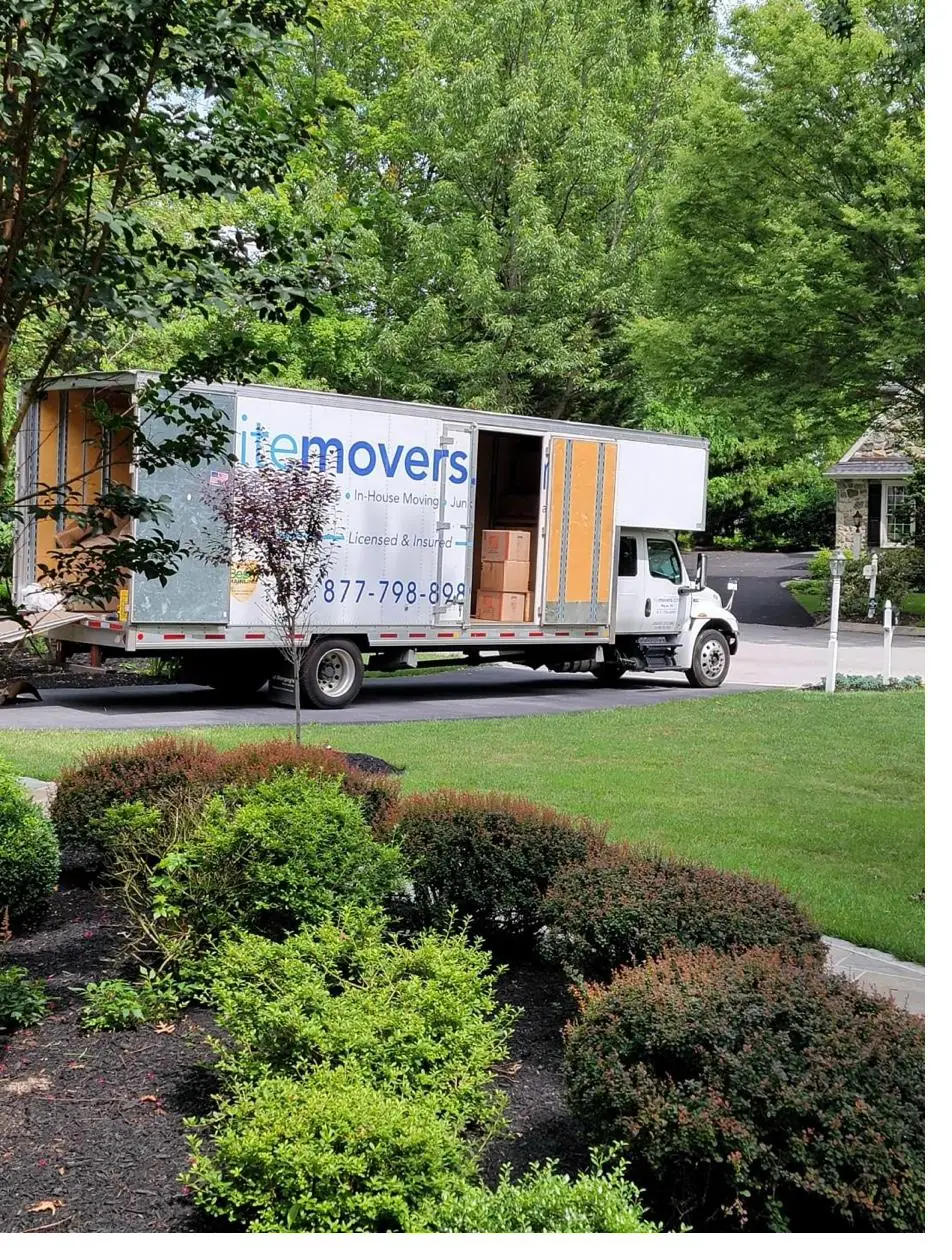 Open LiteMovers truck loaded with labeled moving boxes